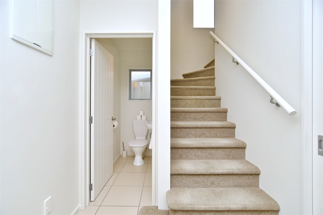 Separate toilet area and stairs at the property