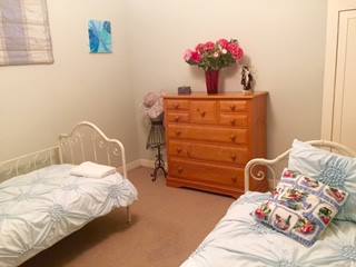 Bedroom with 2 antique beds; new mattresses