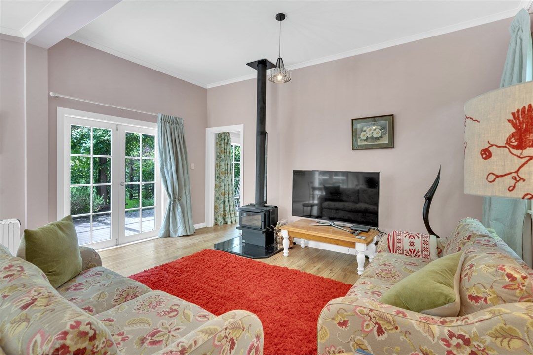 Living area with wood burner, TV and comfortable s