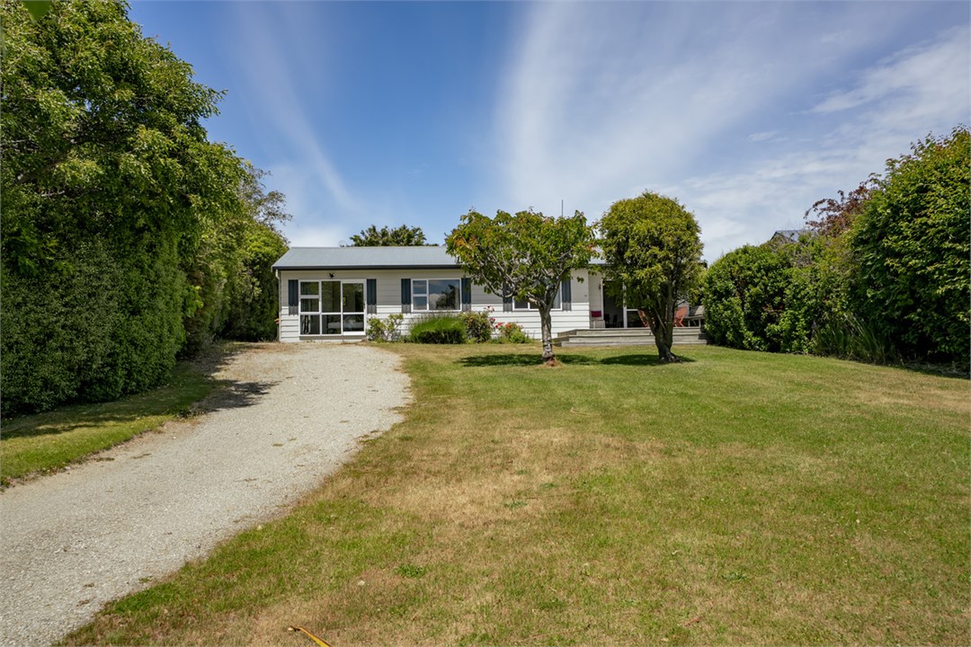 Driveway and large grass garden