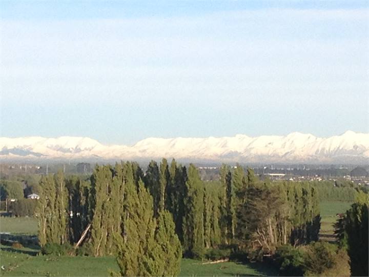 Hill view across farmland to southern alps sunsets