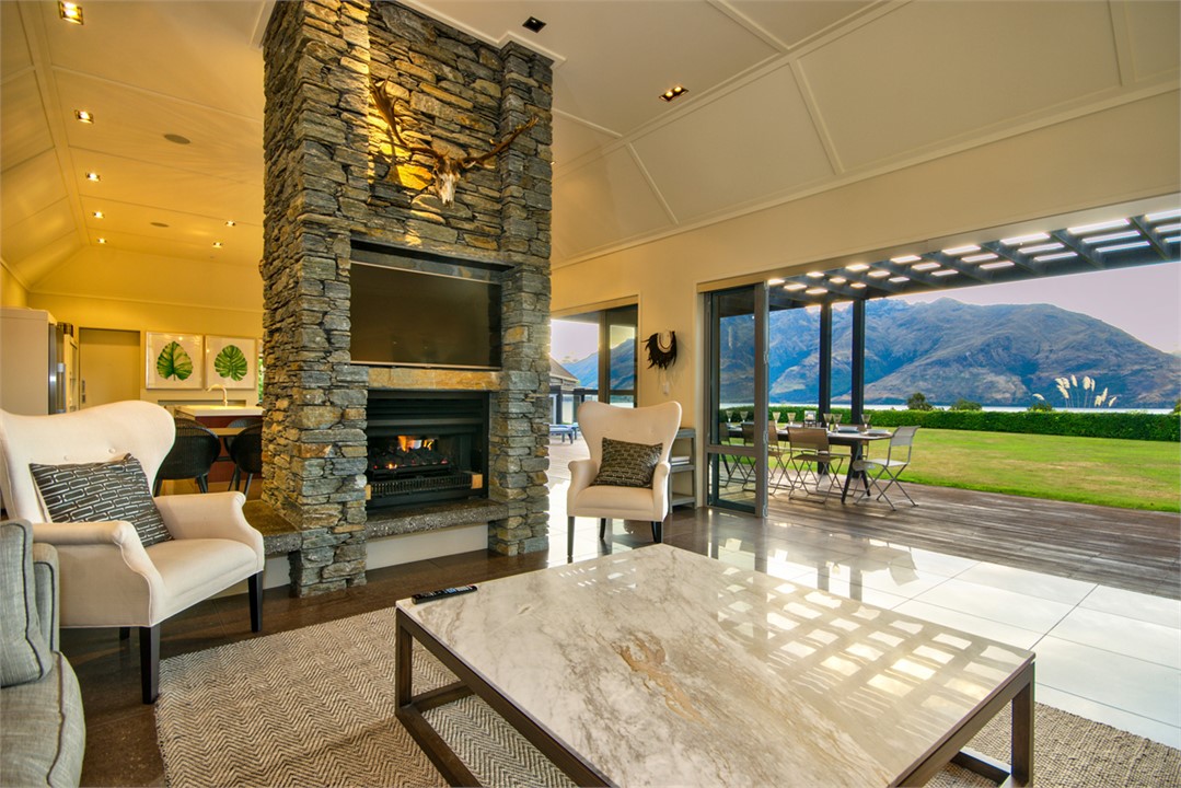 Formal Lounge with feature schist fireplace and vi