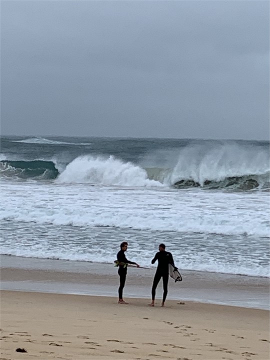 Winter surfing at Puheke Beach