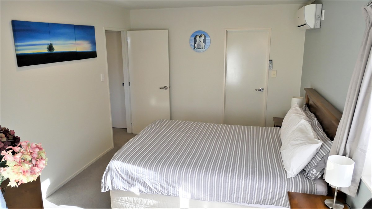 Bedroom with walk in wardrobe and air condition