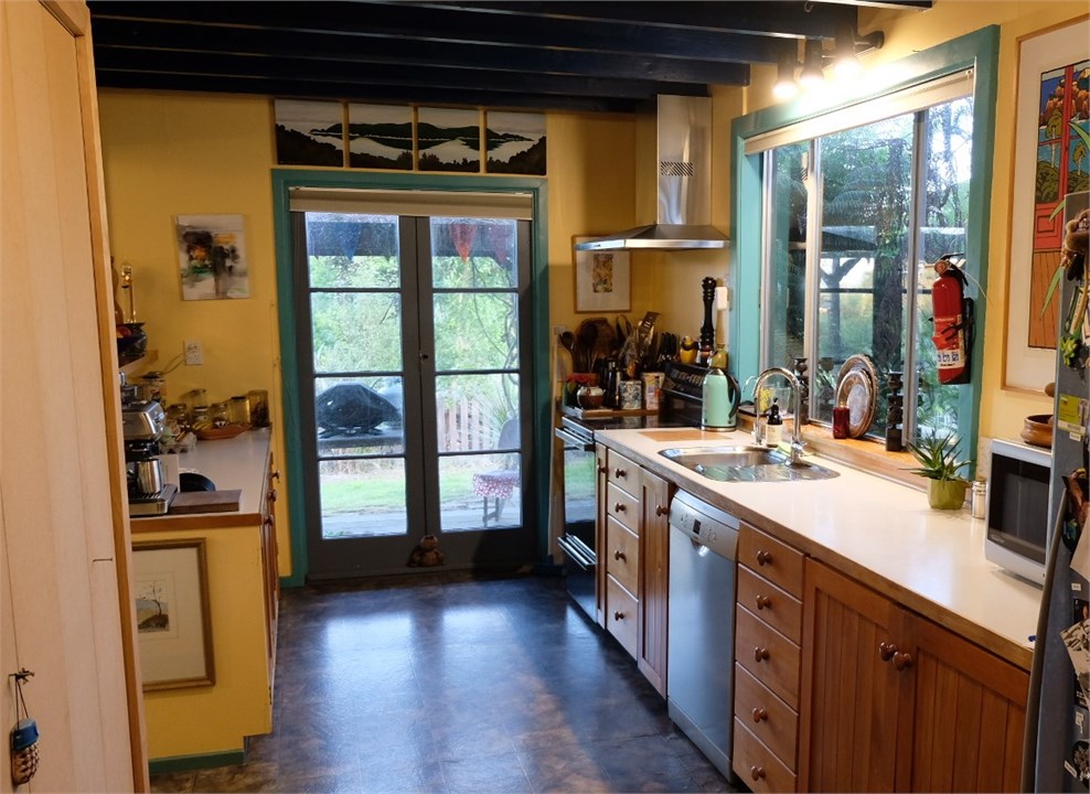 Kitchen with deck to east and farm views