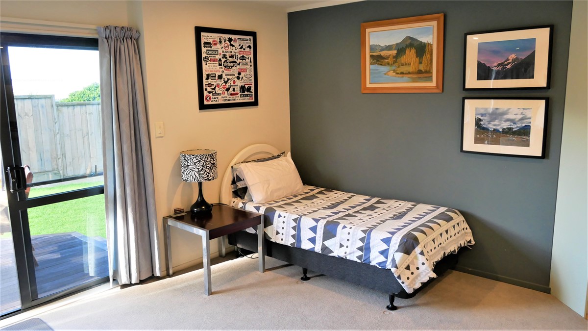 Single bed in living area.