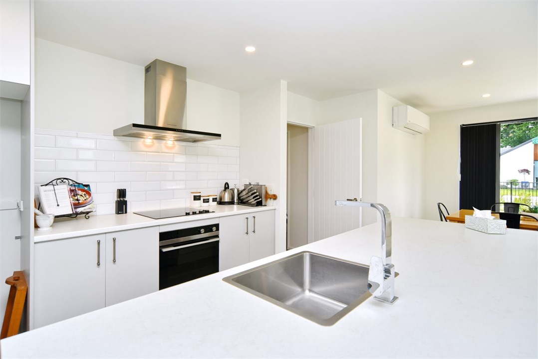 Fully equipped Kitchen area with seating at the be