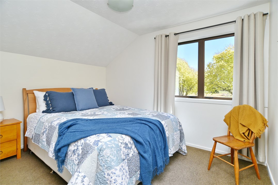 Bedroom 3 has a Queen bed and seating area