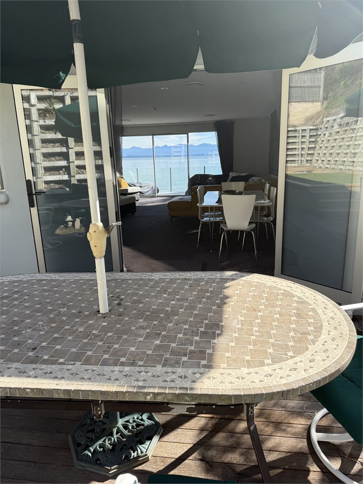 View from back patio through dining and lounge are