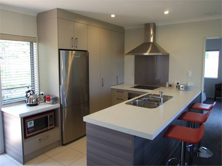 Designer kitchen with top range appliances