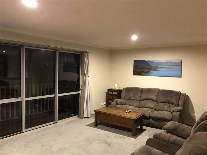 Living area opening up to outside deck via bi slid