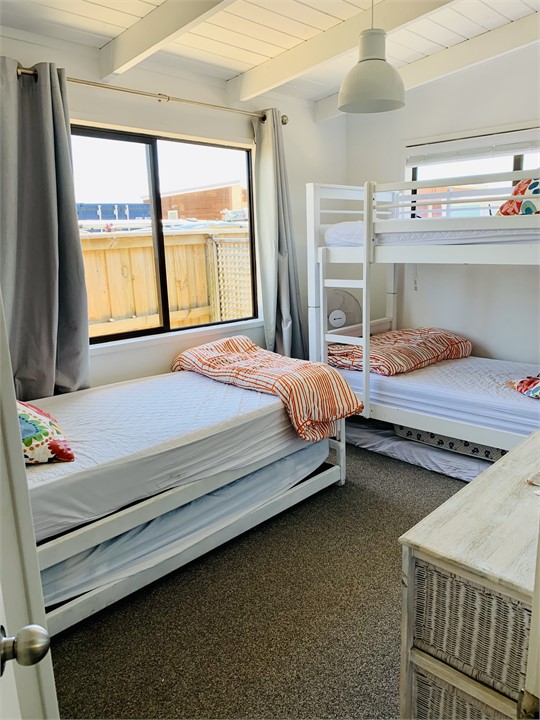 Bunk room with roller bed
