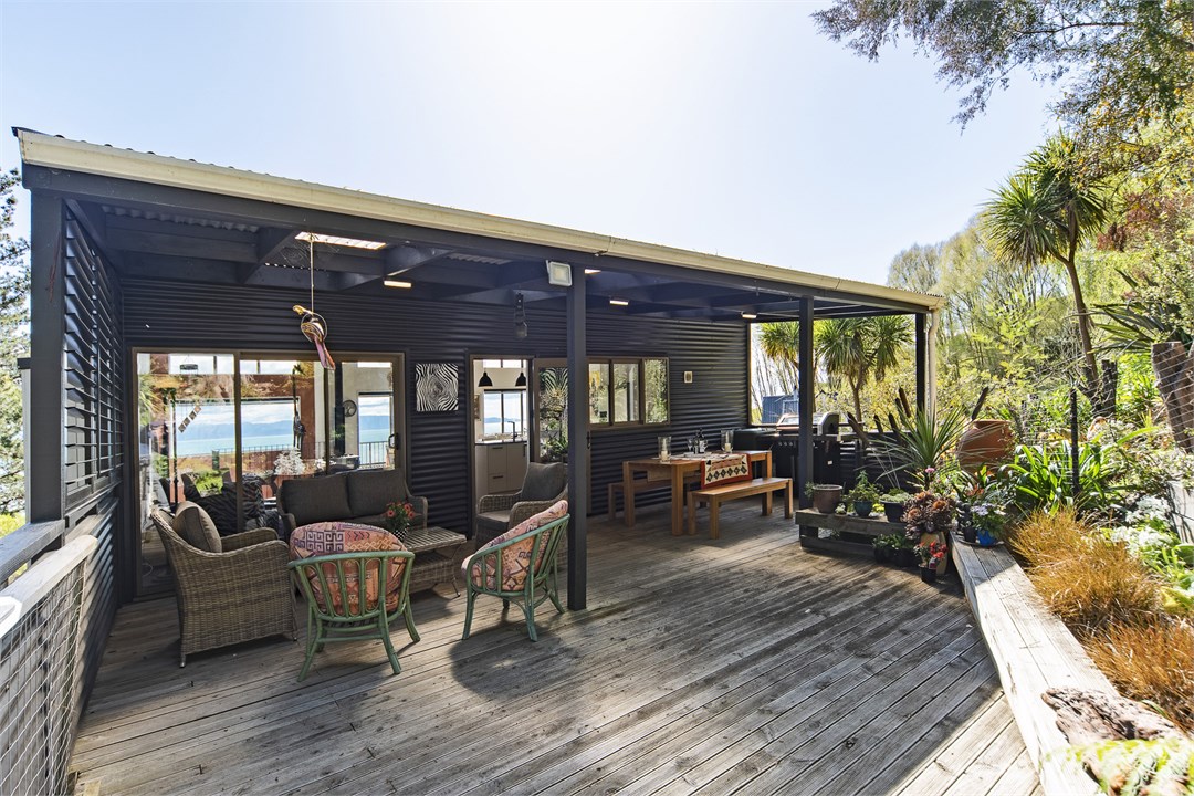 Private deck surrounded by native trees