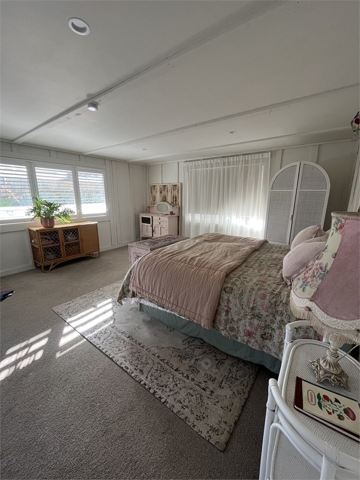 Master Bedroom Downstairs with adjacent bathroom a