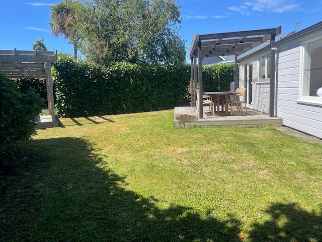 Back lawn with pergola and deck