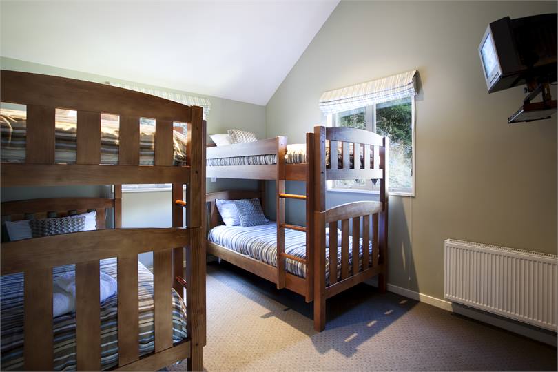 Bunk bedroom with adult size bunk beds