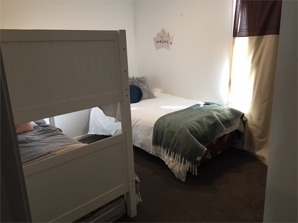 Another view of the third bedroom. Bunks complete