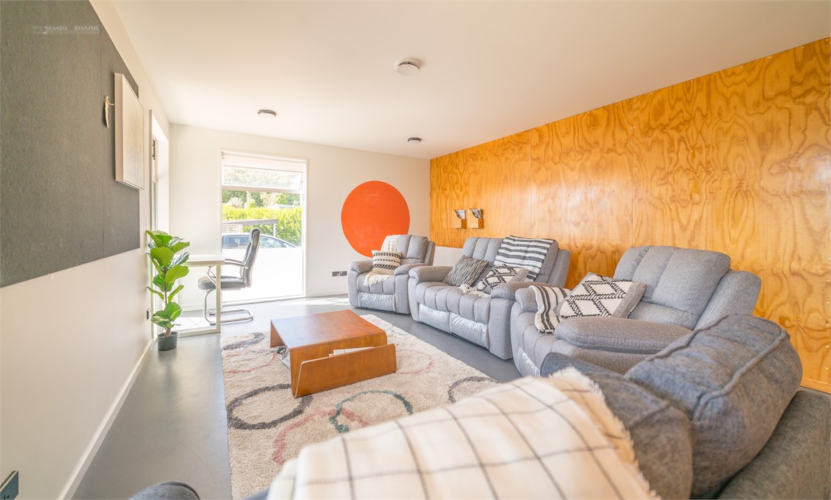 Common space with lazy boys, sofa bed and air matt