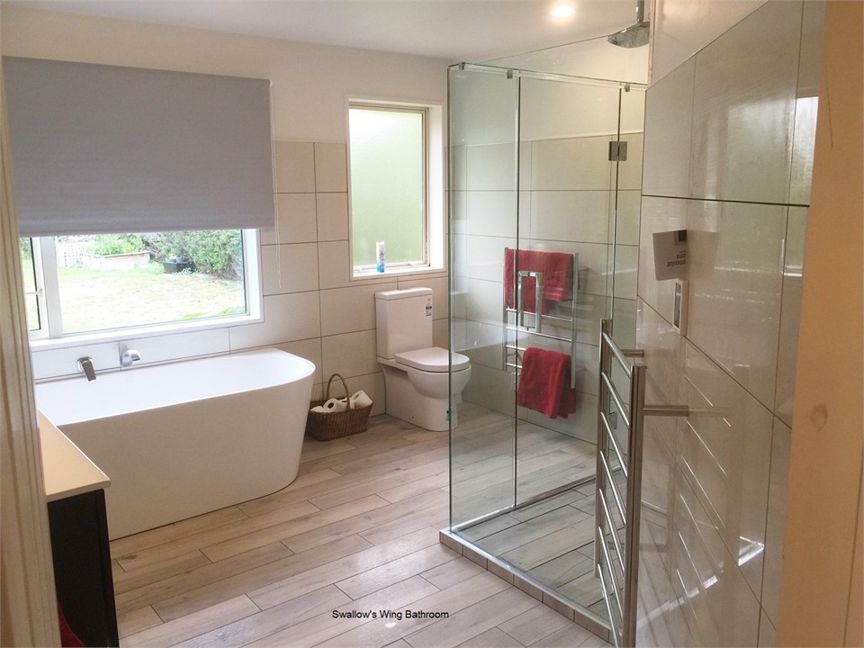 Bathroom with bath and double shower