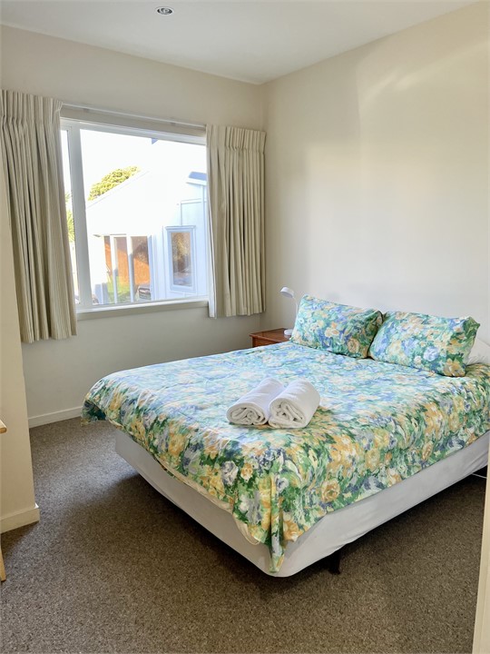 Downstairs bedroom 3.  Comfortable queen sized bed