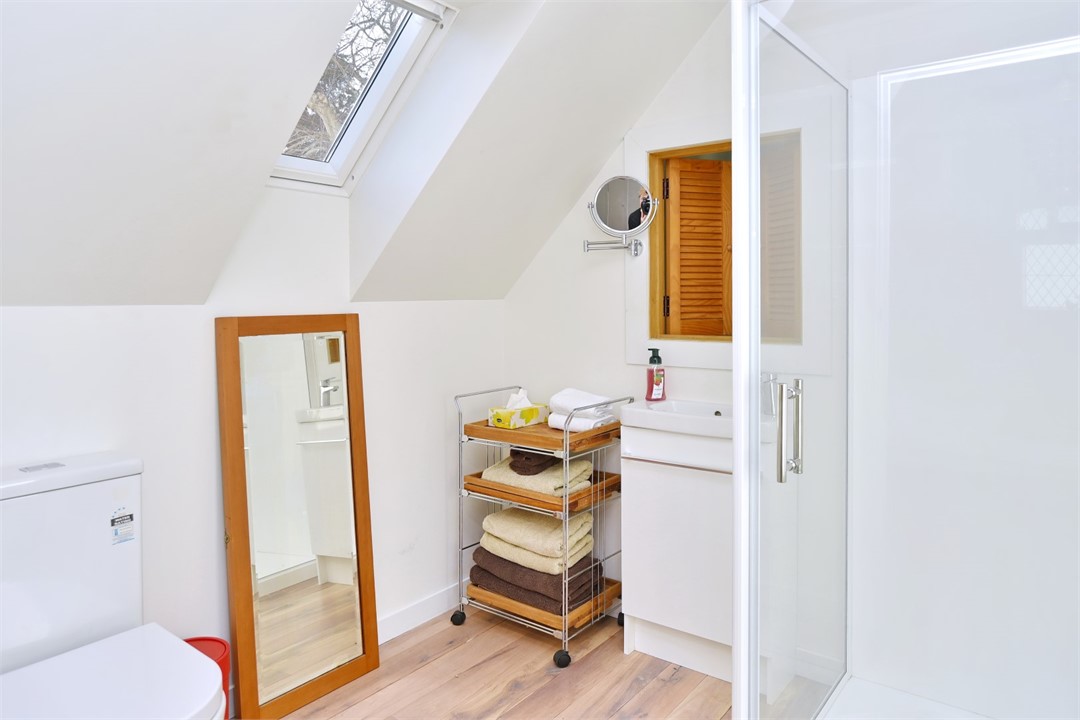 Bathroom has a shower and a toilet