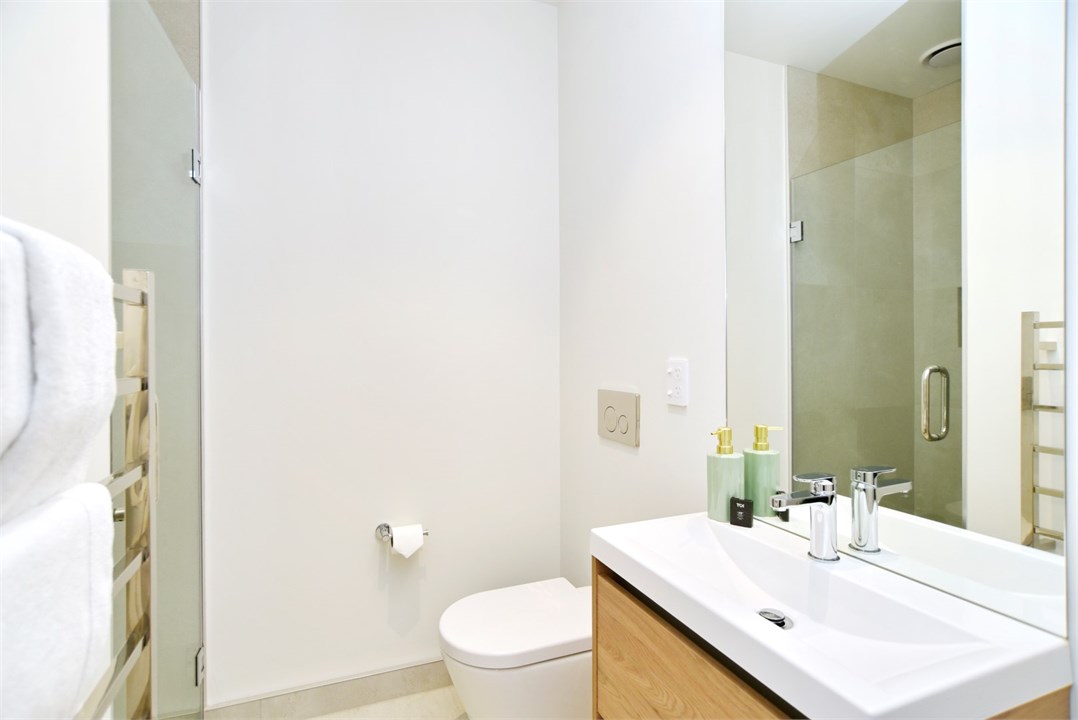 Bathroom 1 has a shower and a toilet