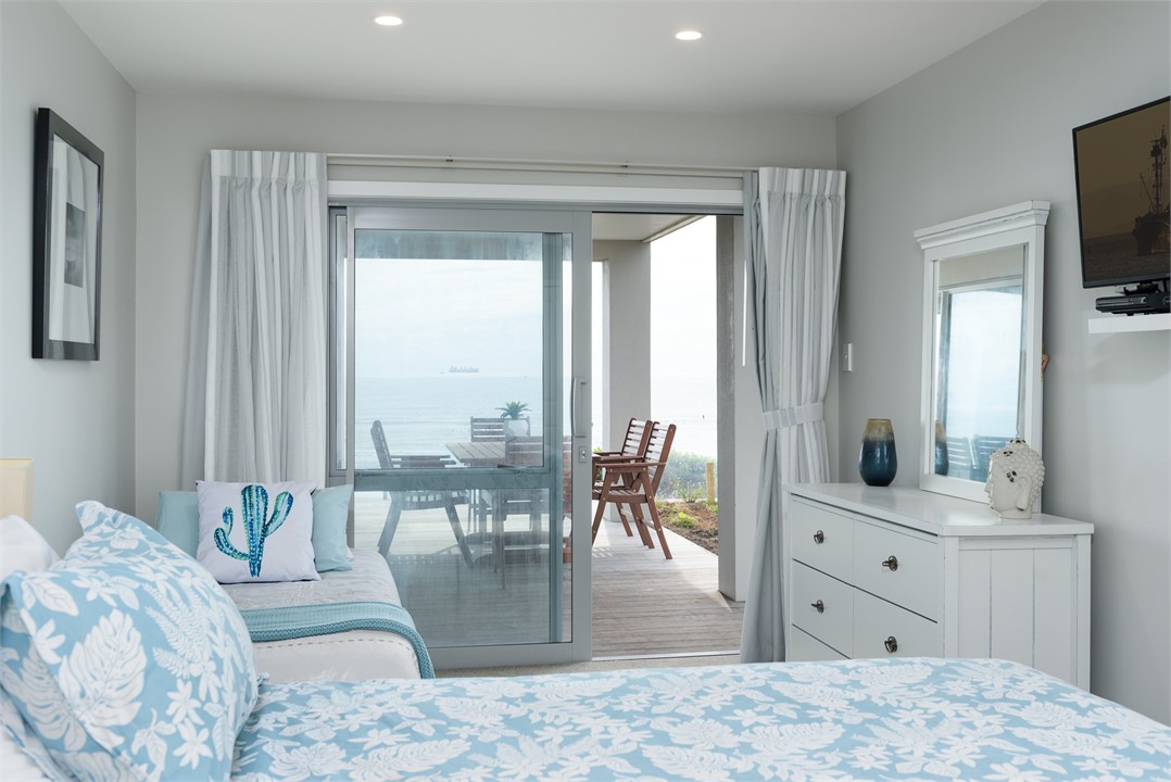 Downstairs bedroom 2 (queen and single bed)