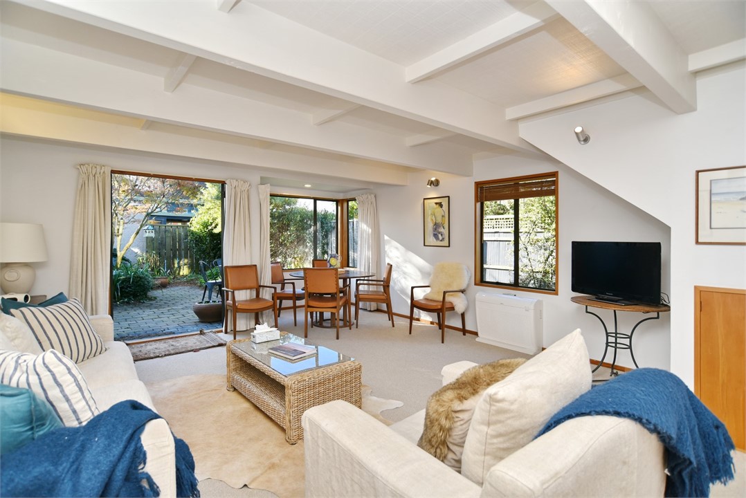 Living room with seating area and a TV