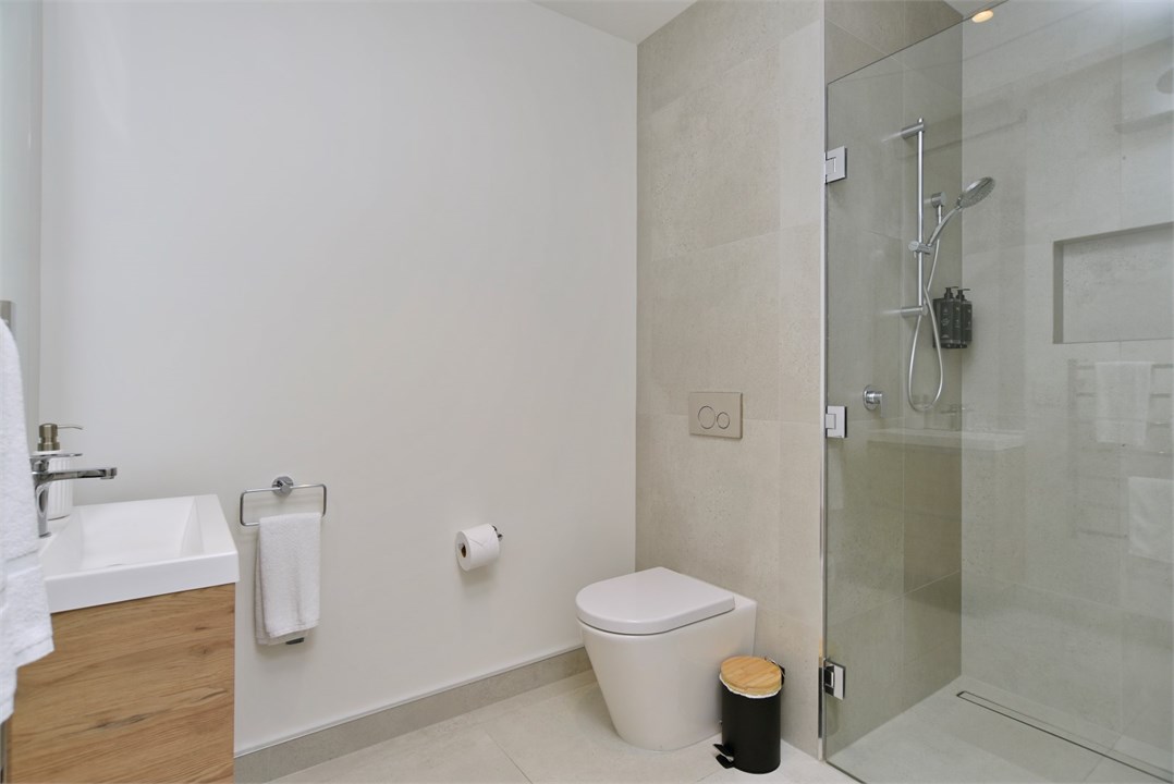 Bathroom 2 has a shower and a toilet