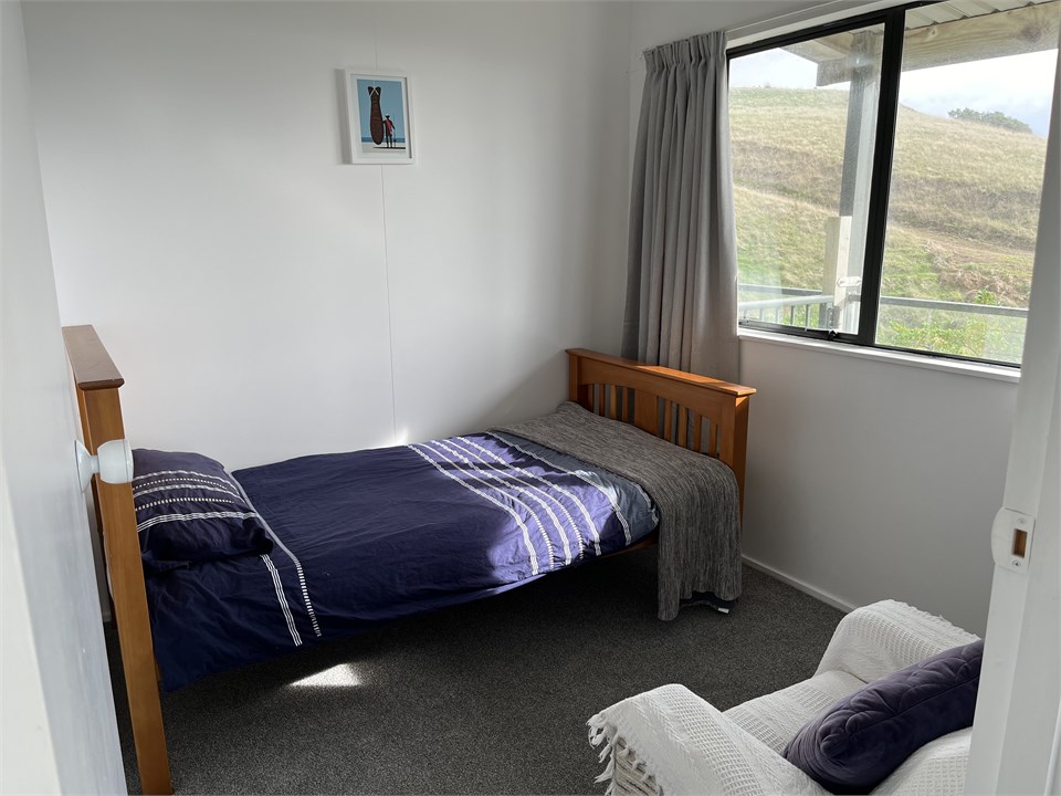 Single bedroom with farm and sea views