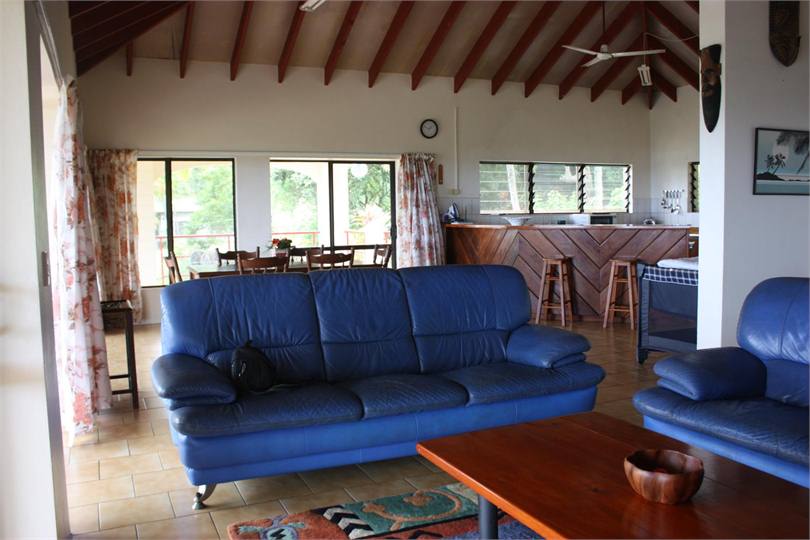 Lounge with dining/kitchen in background