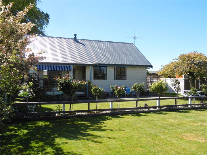 Side view of Cottage garden and BBQ area. 