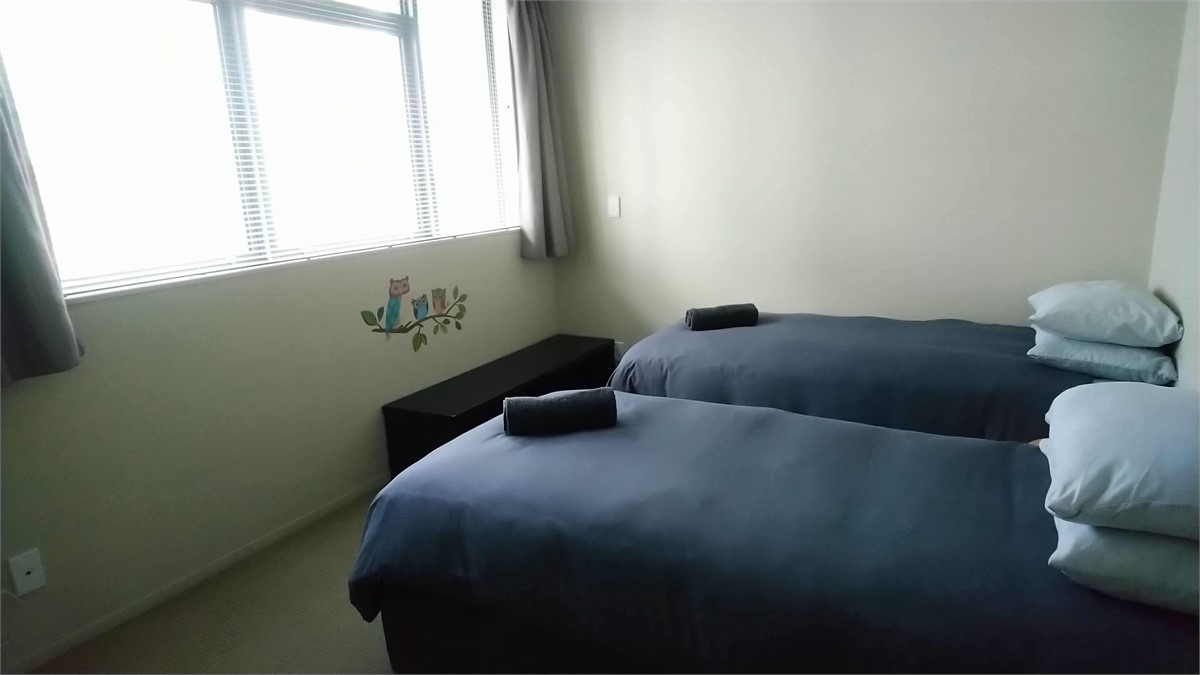 Two single beds in the third bedroom