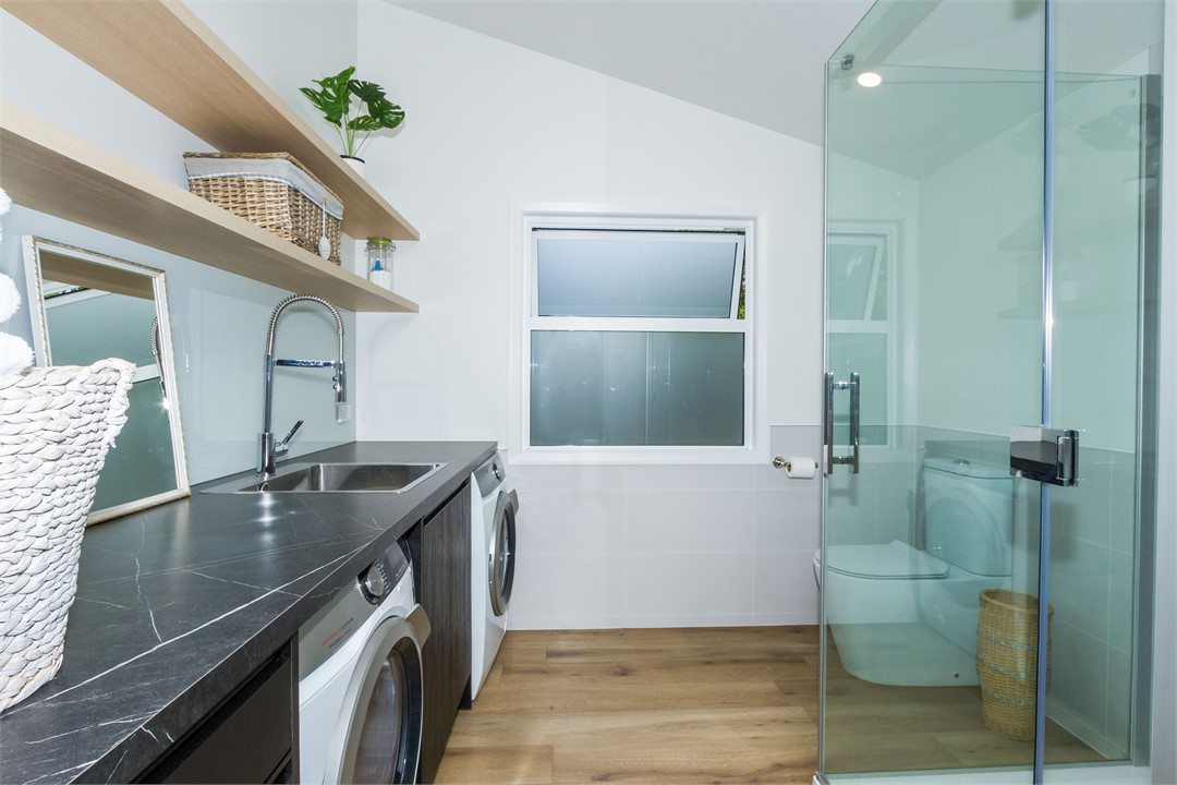 Bathroom 2 with shower, toilet & laundry area