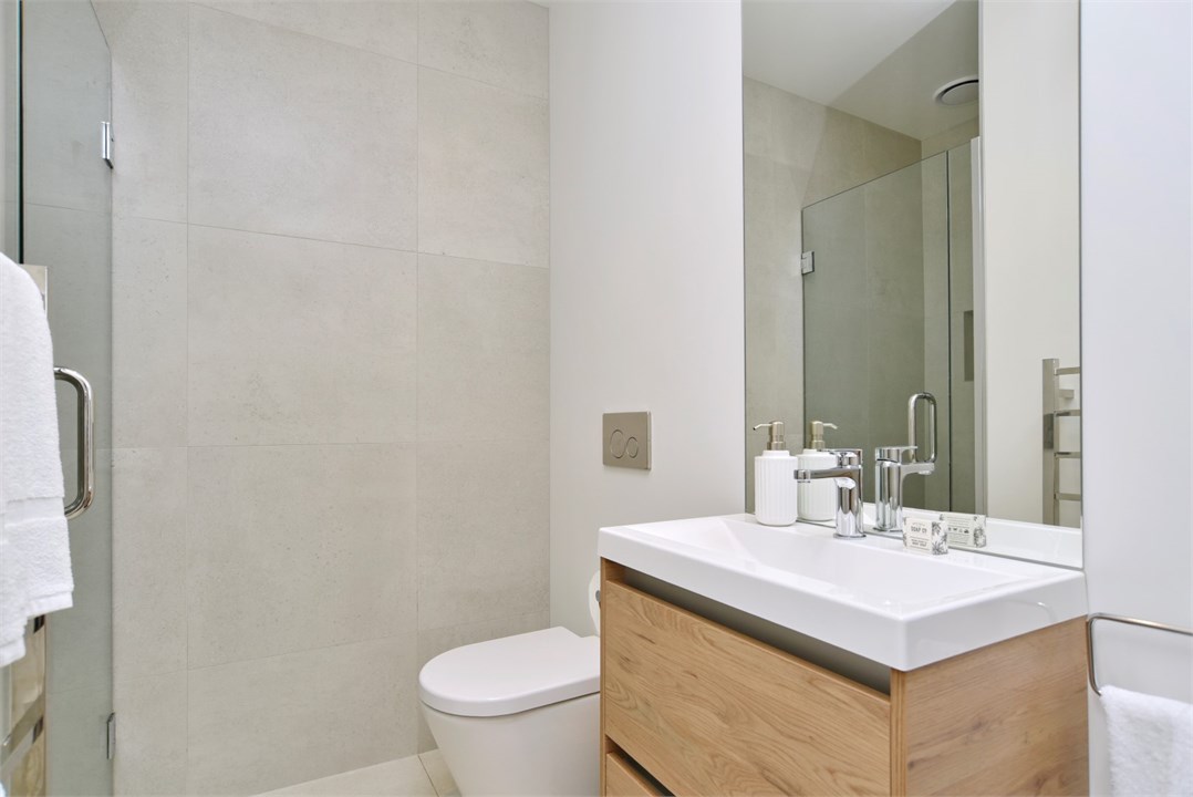 Bathroom 1 has a shower and a toilet