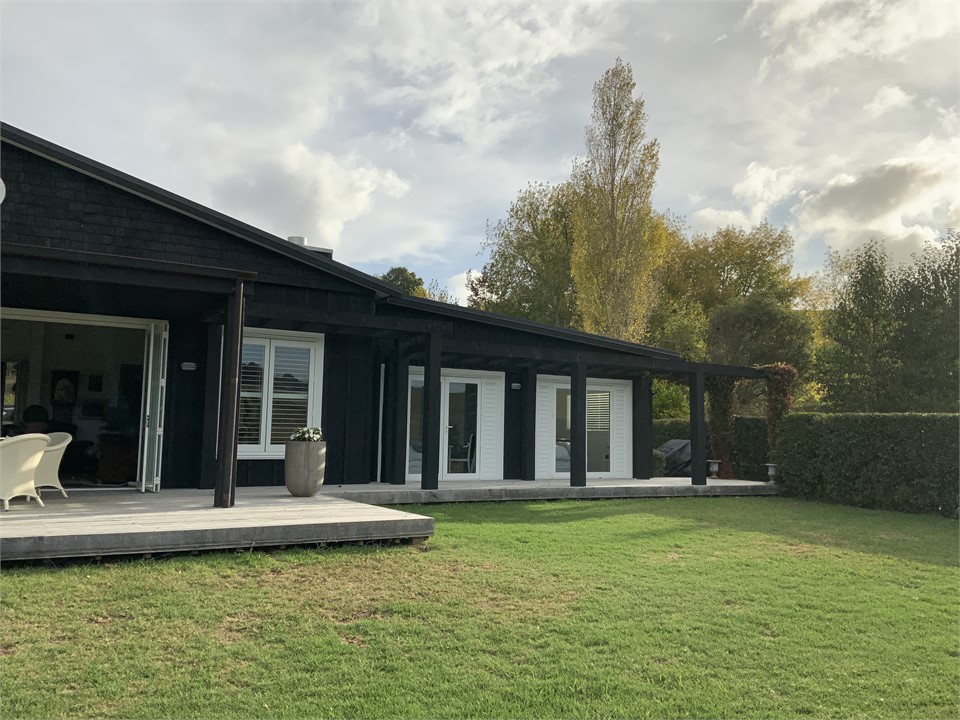 Lawns and deck opening from bedrooms.