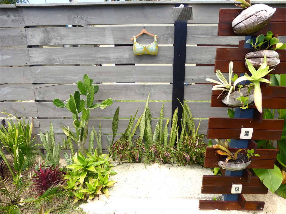 the funky coconut shower is by the pool for a rins