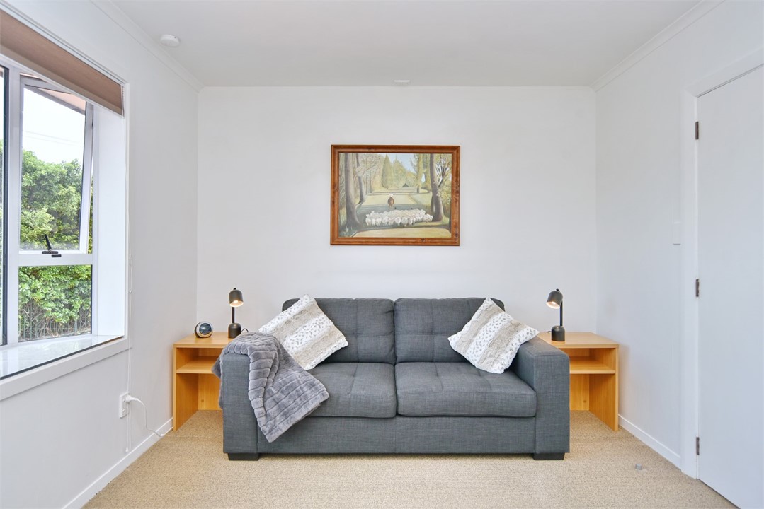 Sofa in living area that pulls out to a double bed