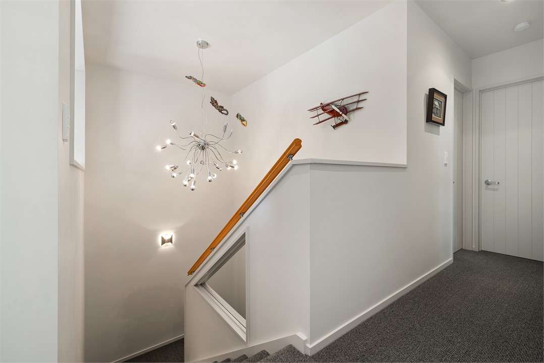 The hall from the foyer leading to the bedroom win