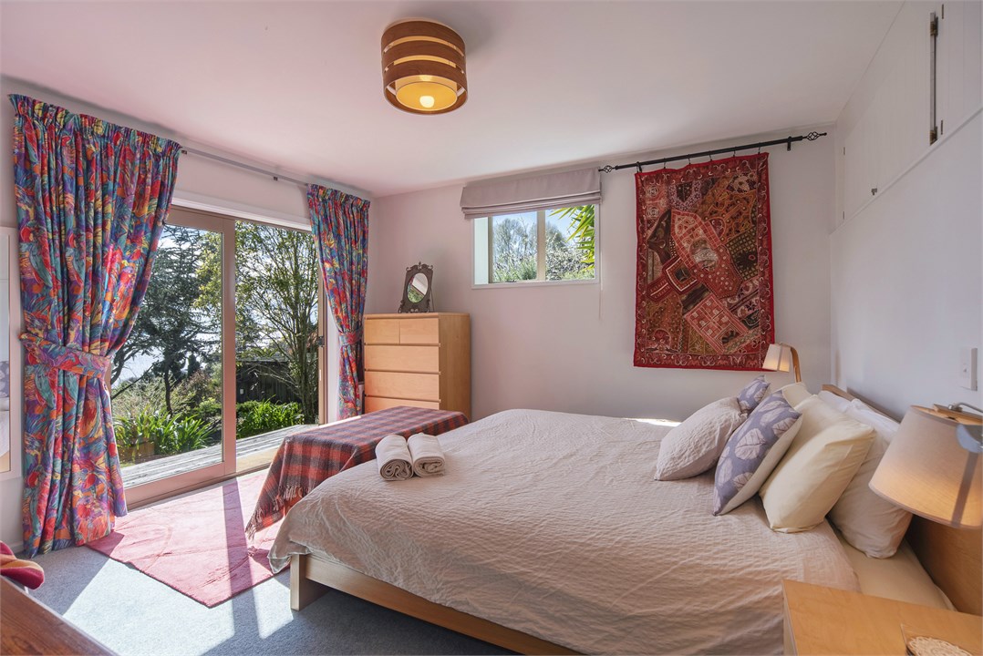 Bedroom 2 (lower level) with King bed and deck