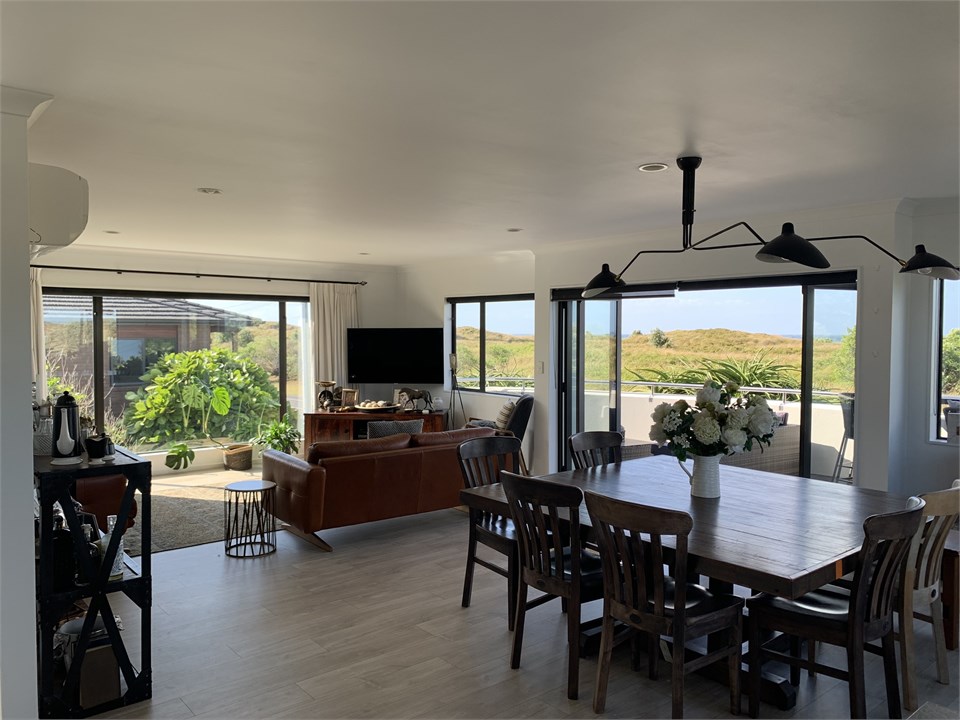 Open plan living space, view from kitchen