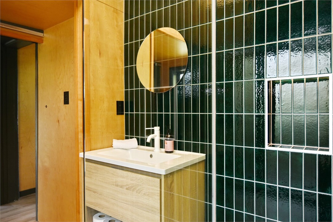 Bathroom has a shower and a toilet