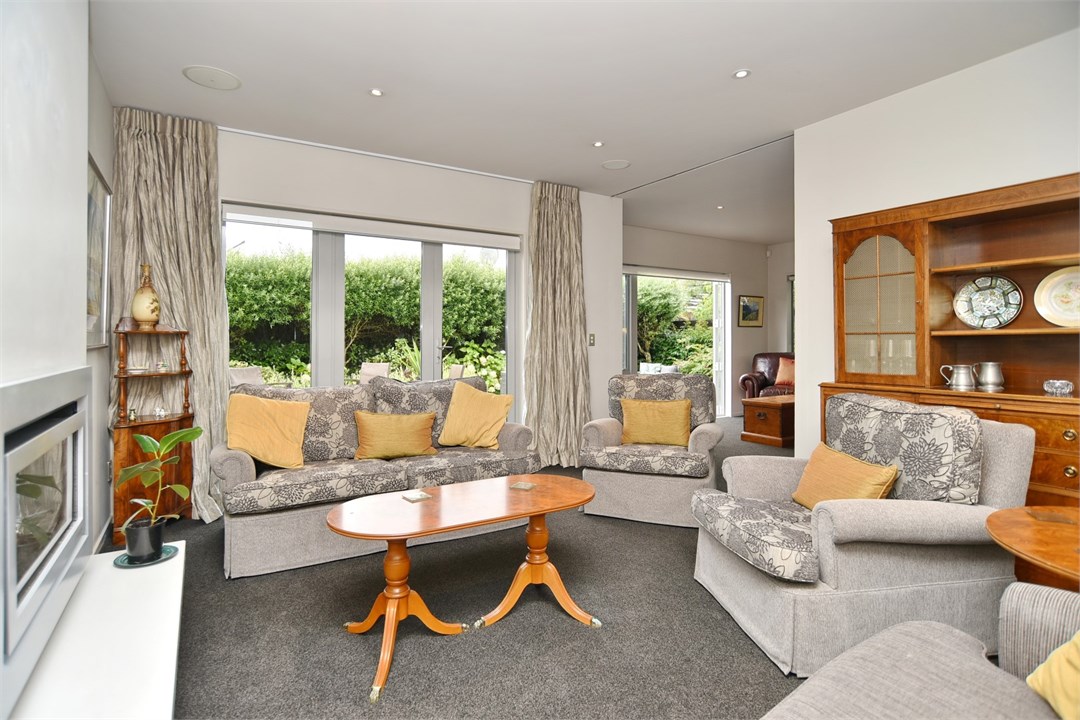 Living room with seating areas and a fireplace