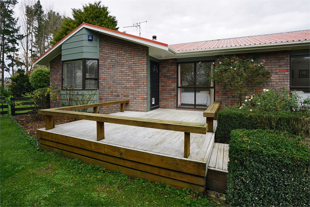 View of the property building and deck