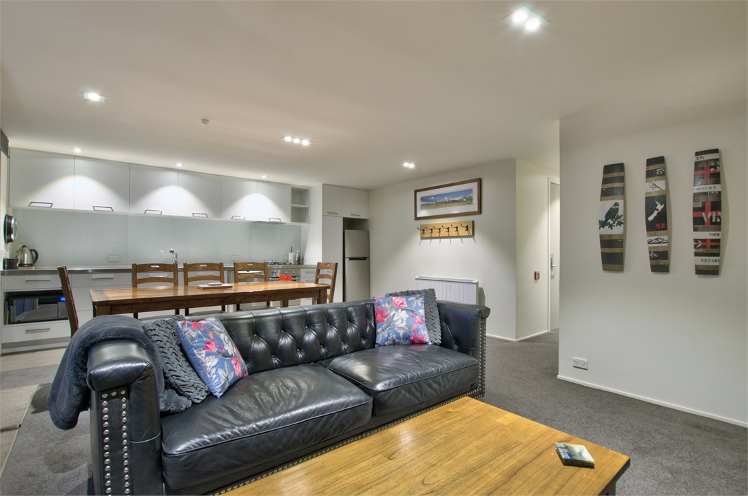 Open living, kitchen, dining and lounge areas.