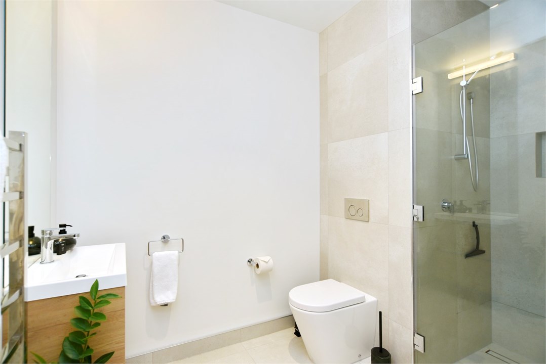 Bathroom 2 has a shower and a toilet