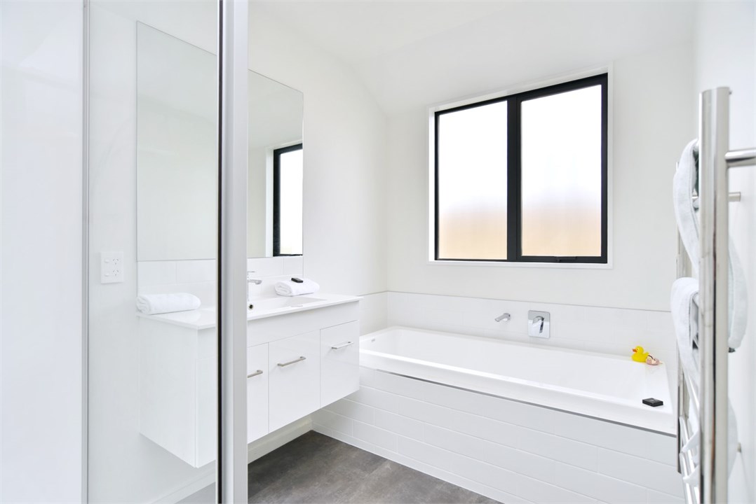 Bathroom 1 has a shower, bathtub and a separate to