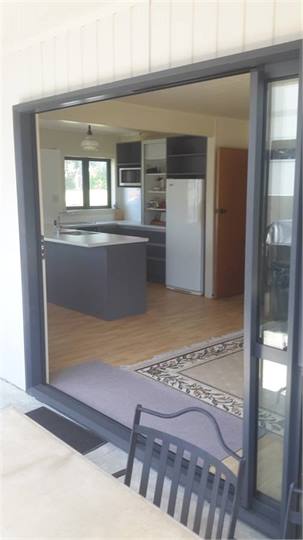 Outside looking in to lounge kitchen