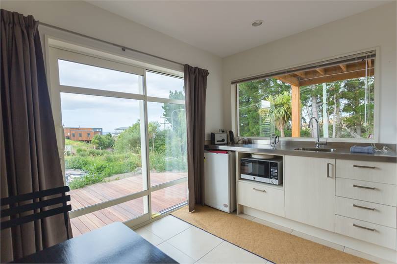 The kitchenette with fridge, microwave