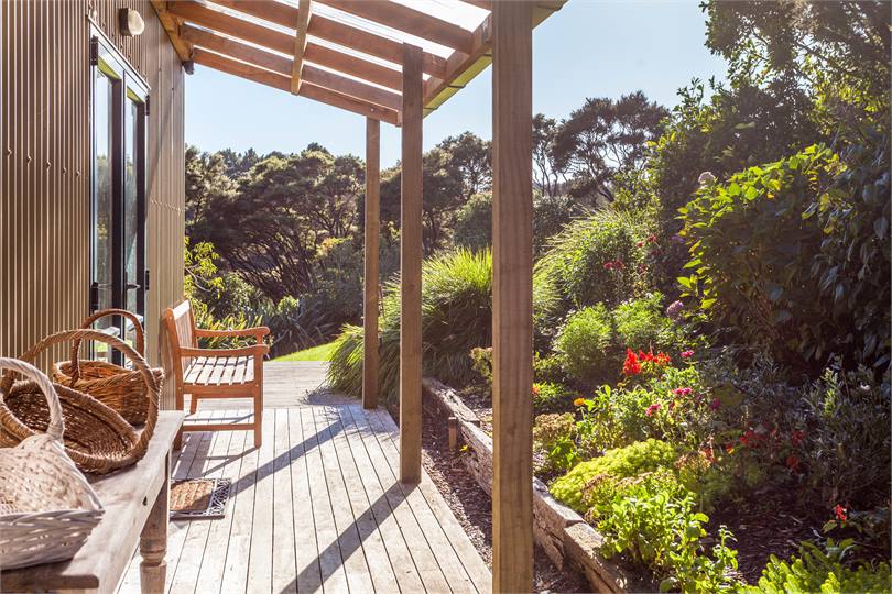 Veranda looking towards the bush with cottage gard